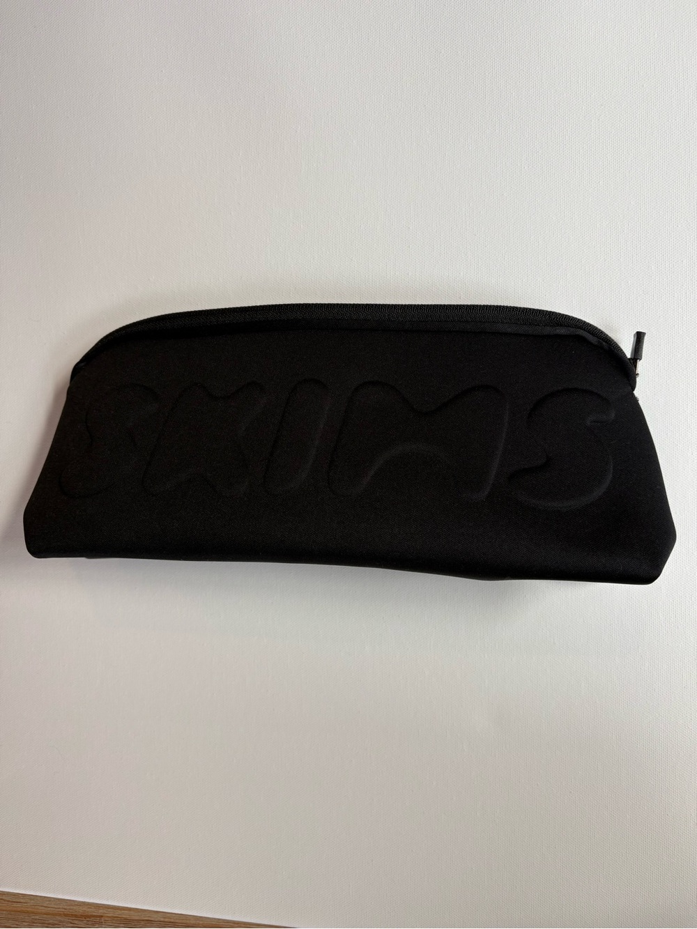 SKIMS Black Embossed Padded Cosmetic Case